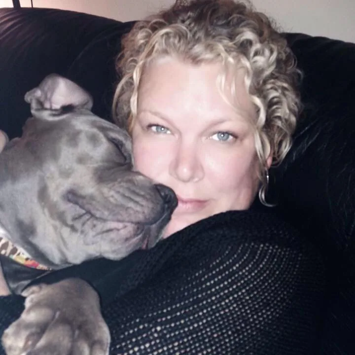 Marcy, the historian behind Roaming History, with her grey pit bull